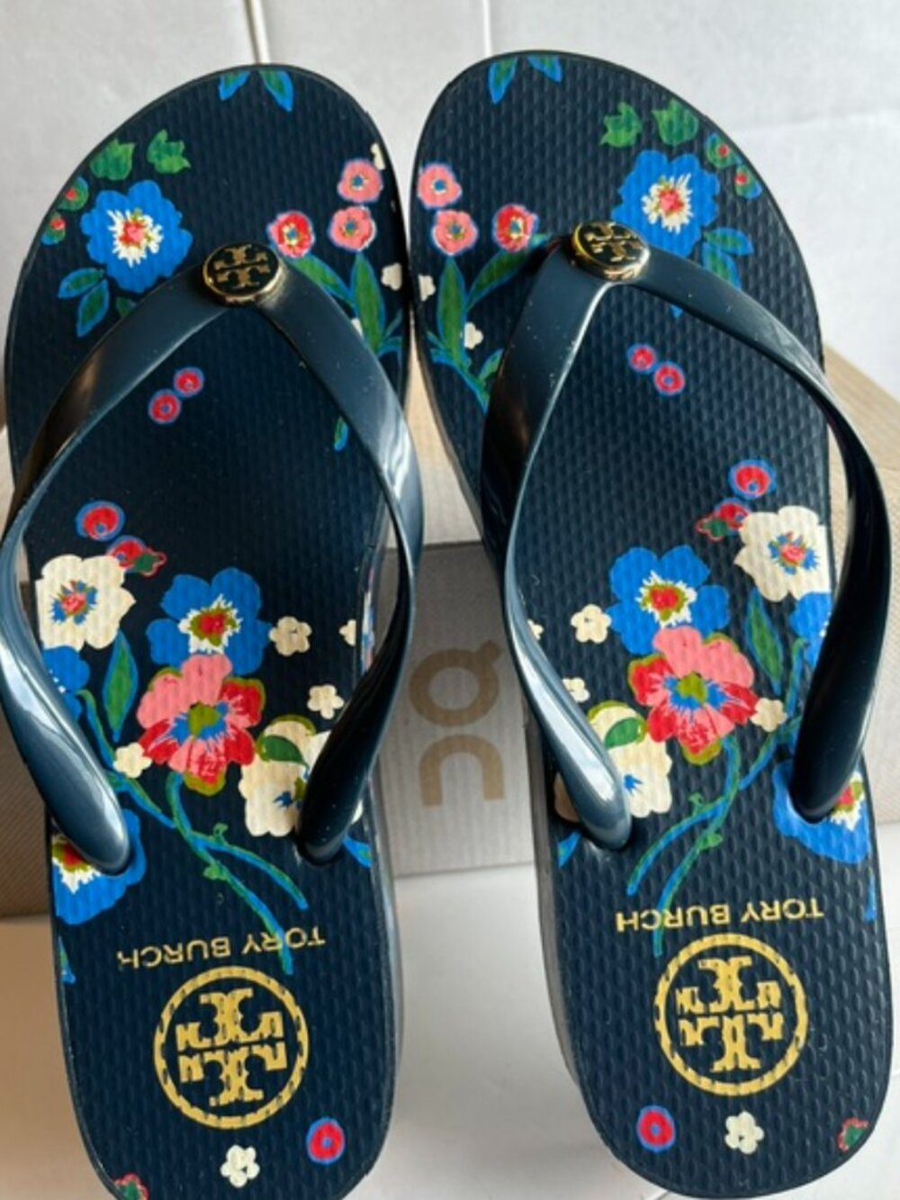 Tory Burch floral platform slippers.